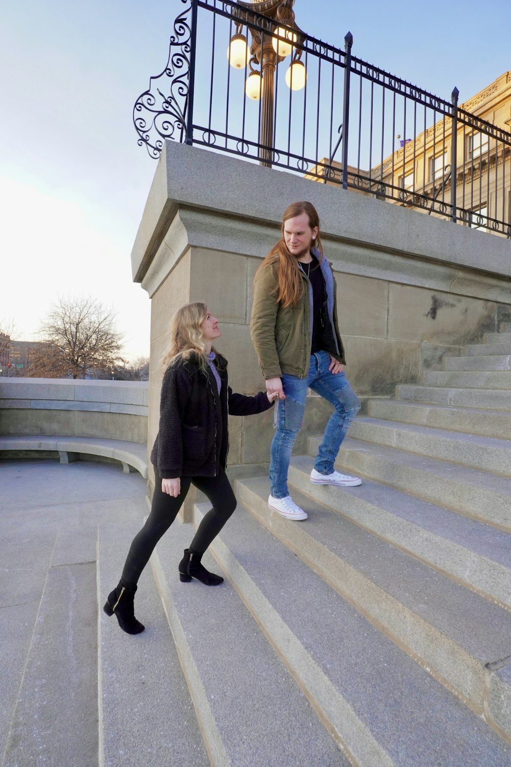 a couple of women walking down a flight of stairs