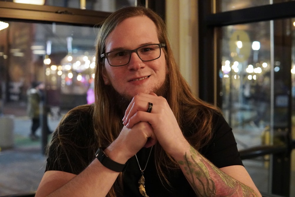 a woman with long hair and glasses