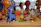 Brightly colored alebrije sculpture with whimsical shapes and detailed craftsmanship displayed on a wooden table.