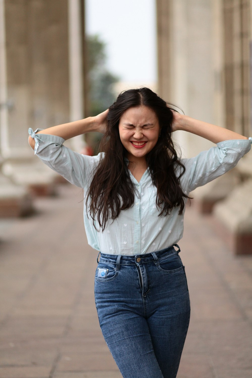 a woman with her arms up