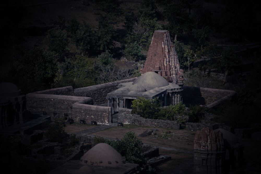 a group of buildings in a forest