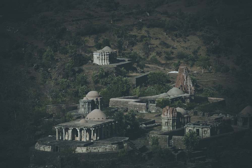 a group of buildings in a mountainous area