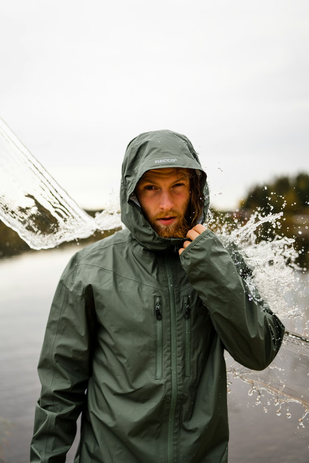 a person wearing a hoodie and standing in the snow