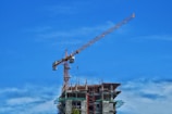 a crane lifting a building
