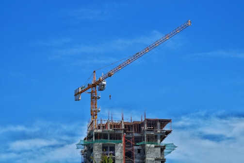 a crane lifting a building
