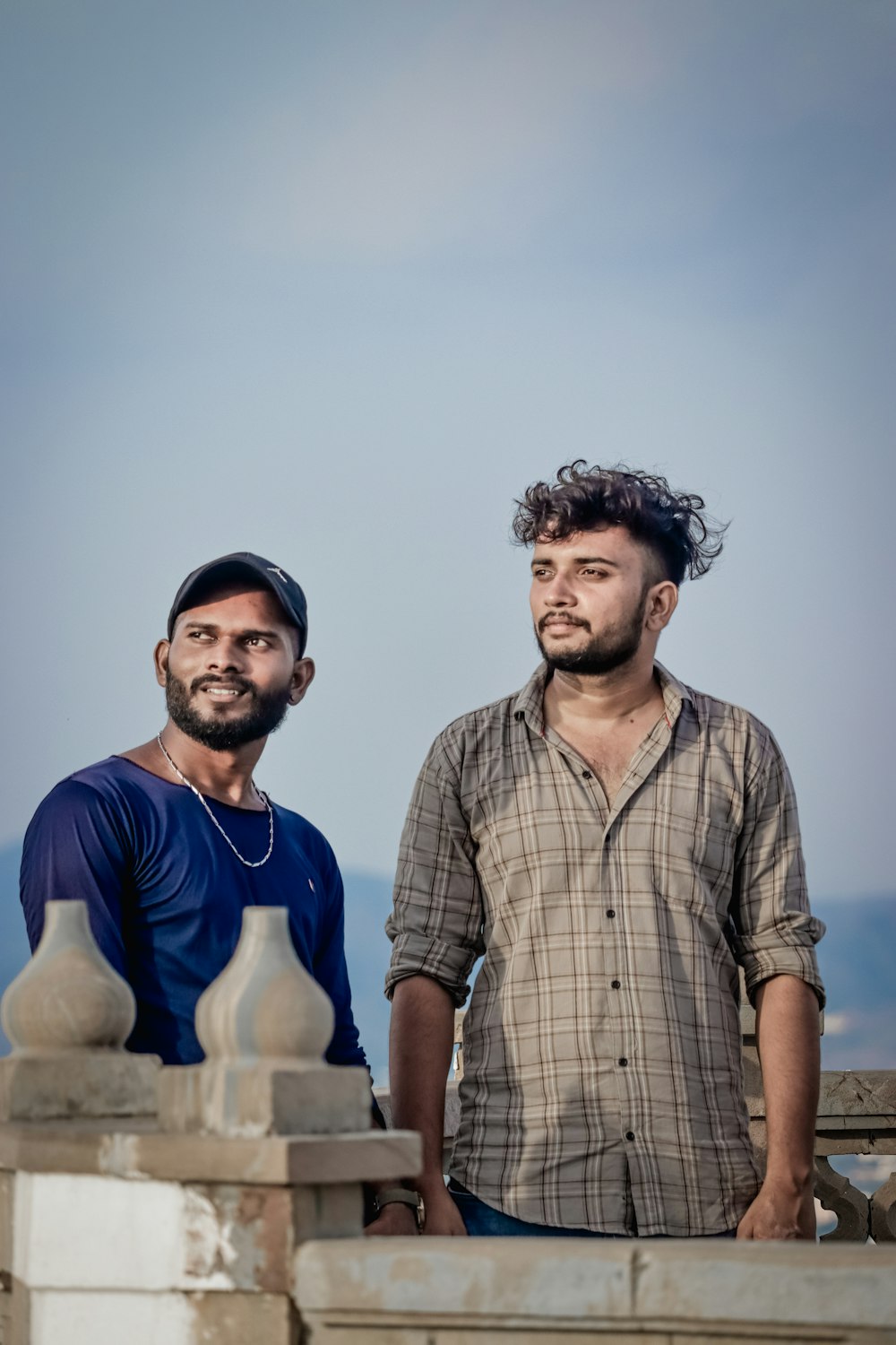 a couple of men posing for the camera