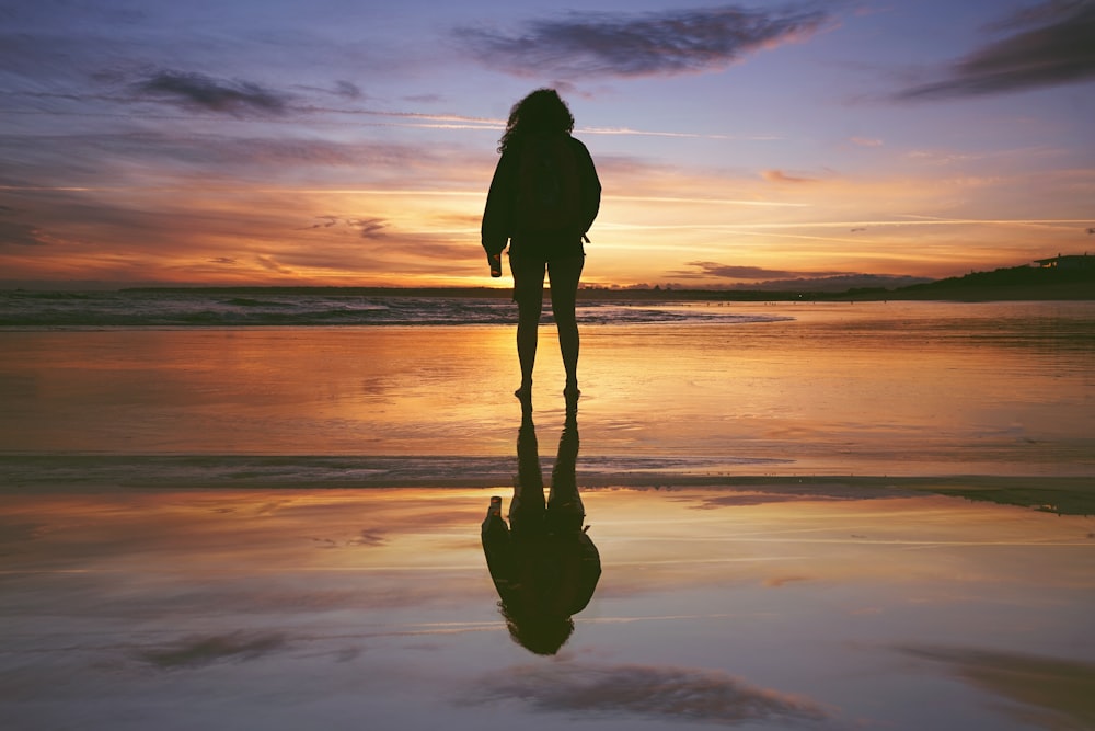 a person walking on a beach