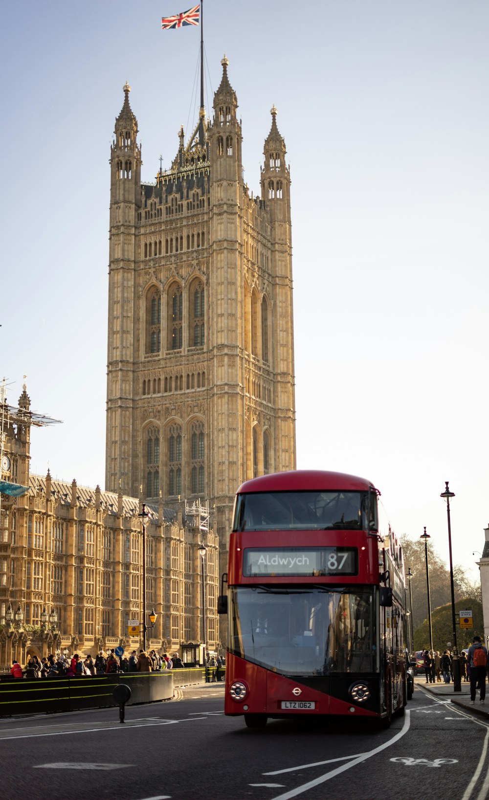 a double decker bus in front of a large building