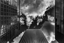 a few skyscrapers with smoke coming out of them