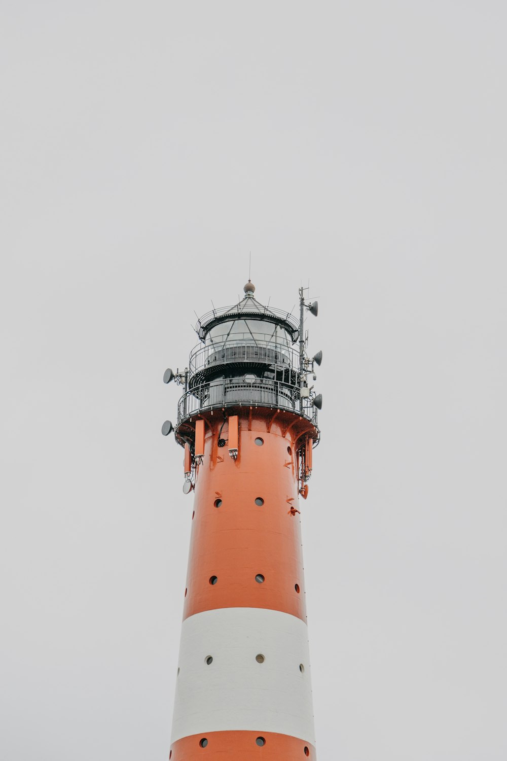 a lighthouse with a white top