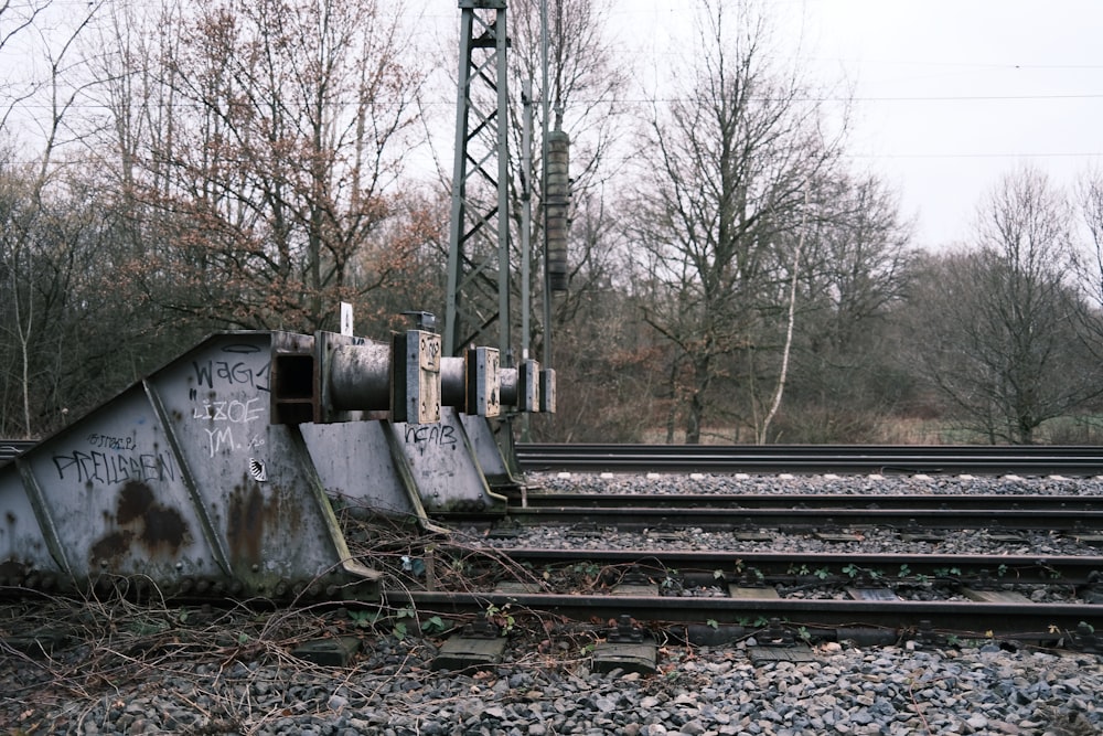 a train track with graffiti