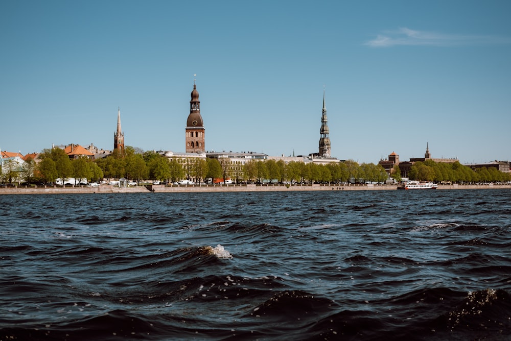 a body of water with a building in the background