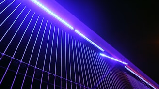 Futuristic AI-inspired pattern with geometric shapes illuminated in electric blue and violet.