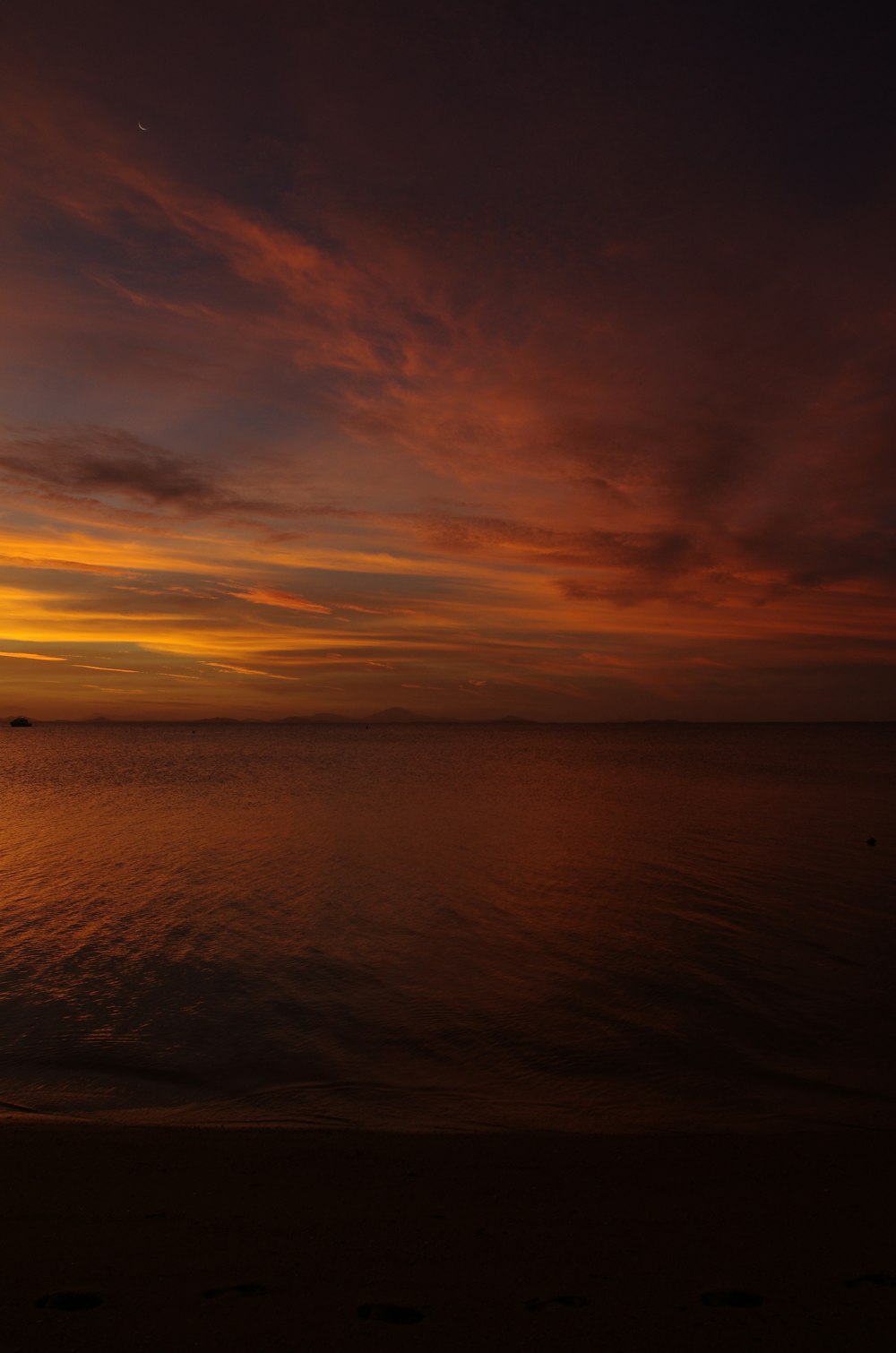 a sunset over a body of water