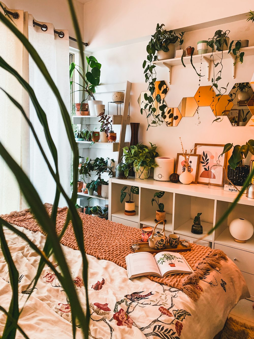 a room with a bed and shelves