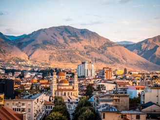 a city with mountains in the background