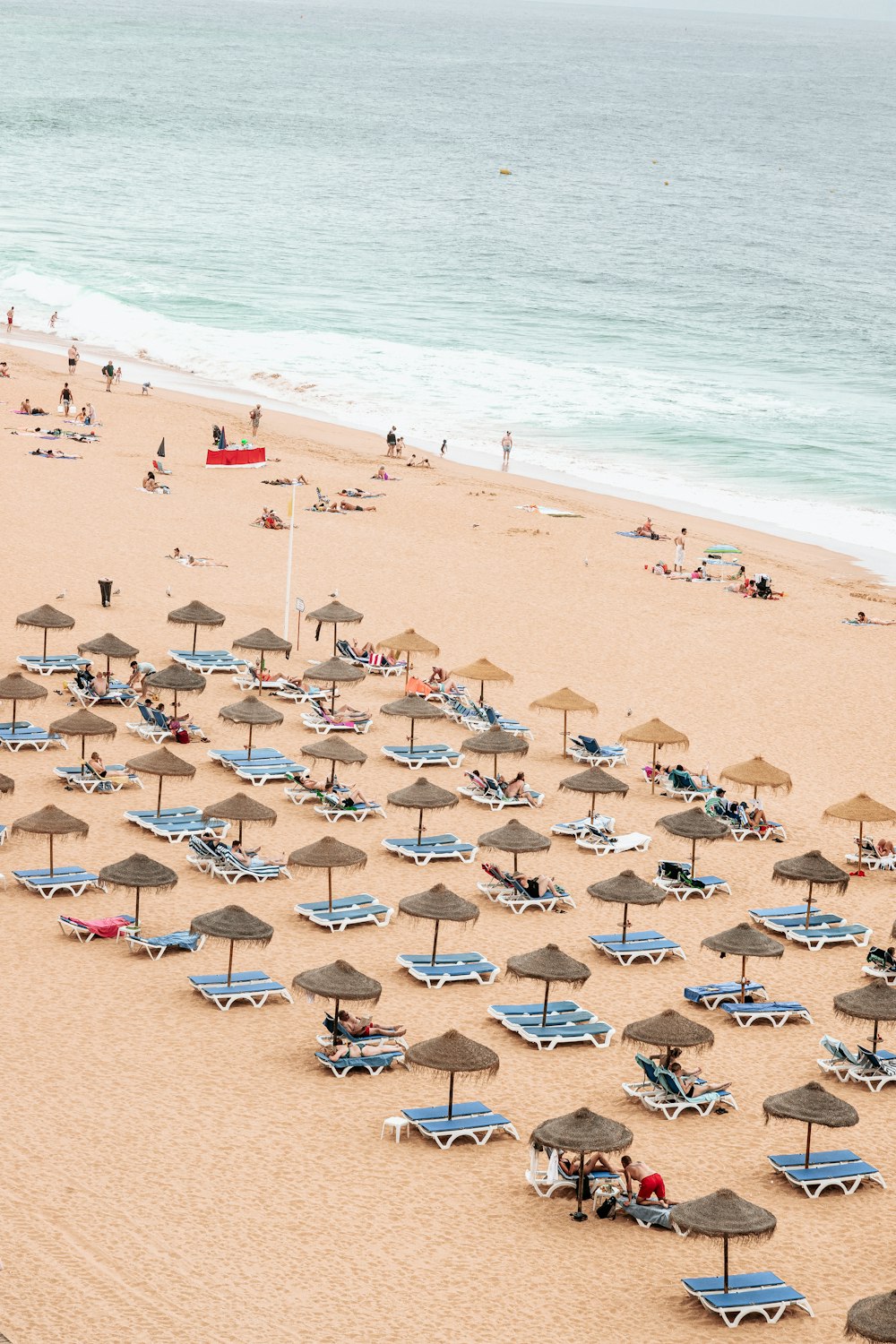 a beach is filled with umbrellas