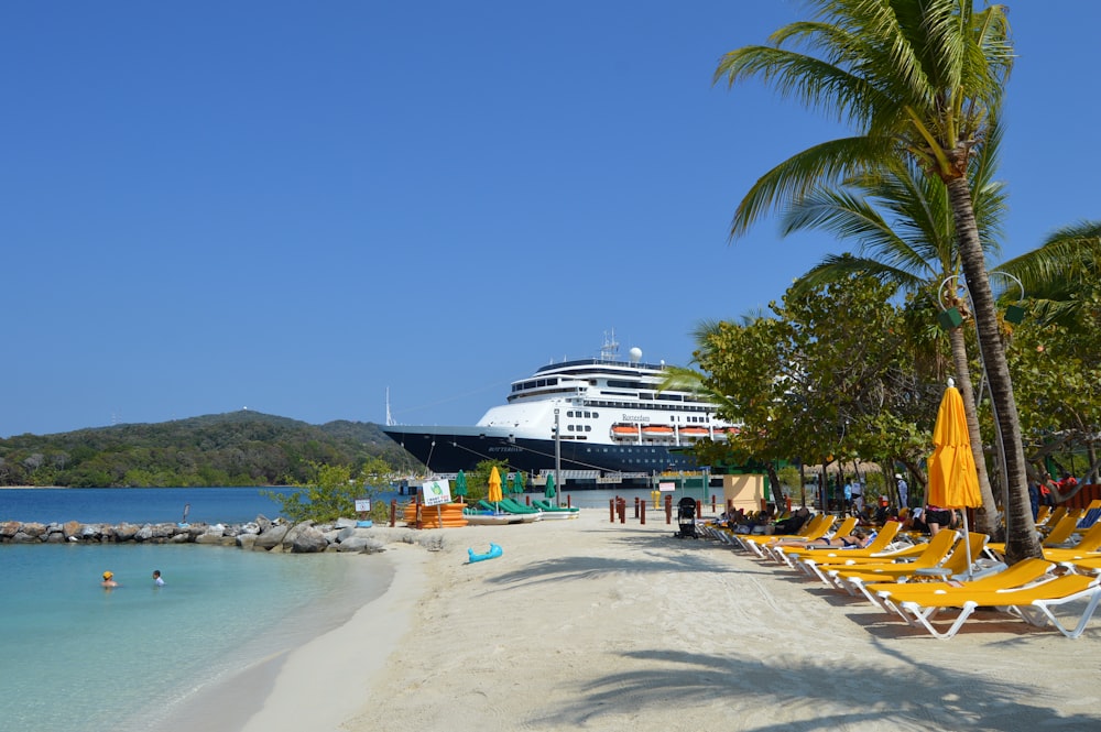 a boat sitting on top of a sandy beach