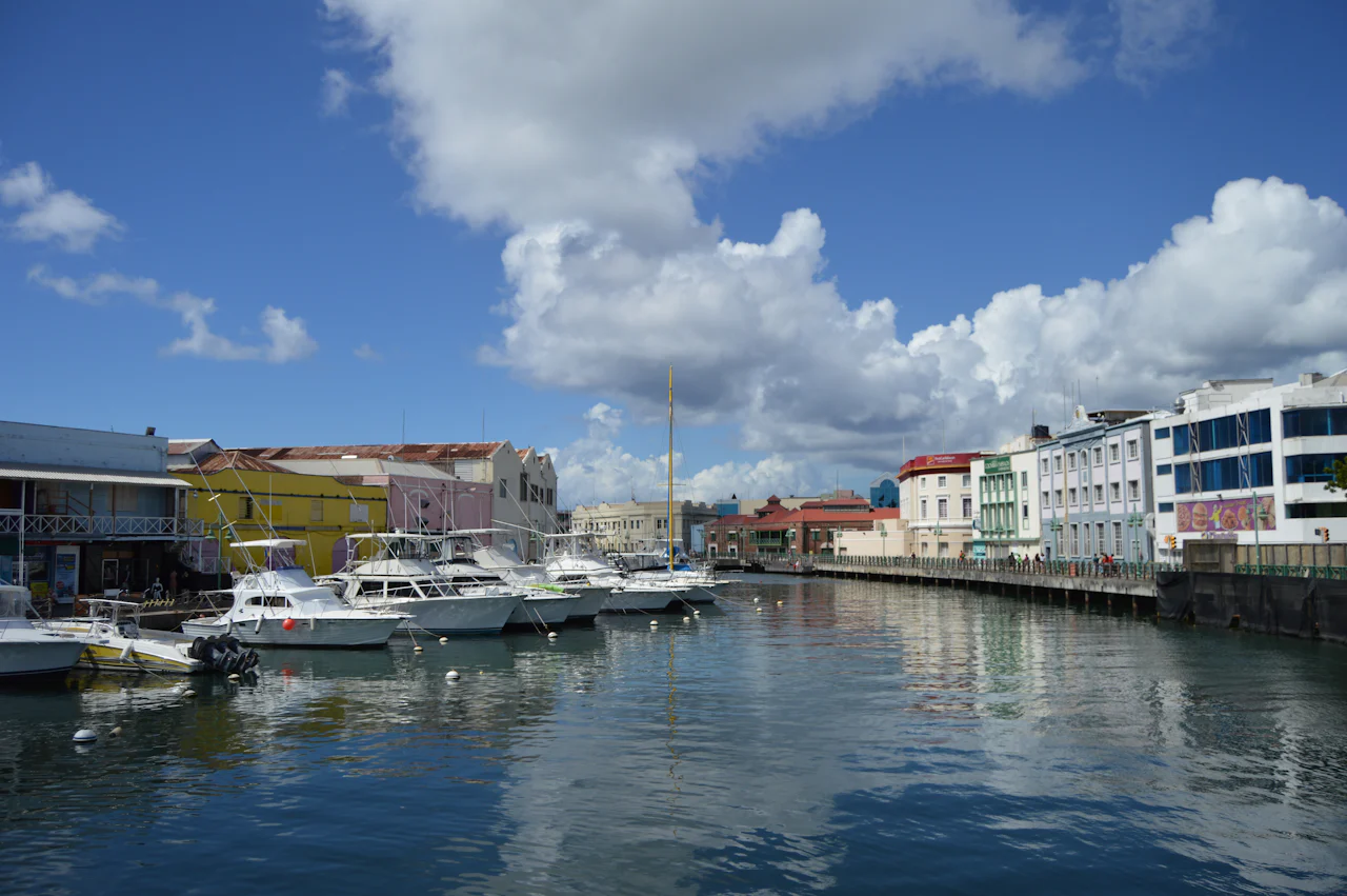 Boats moored along the river waterfront in Bridgetown, Barbados