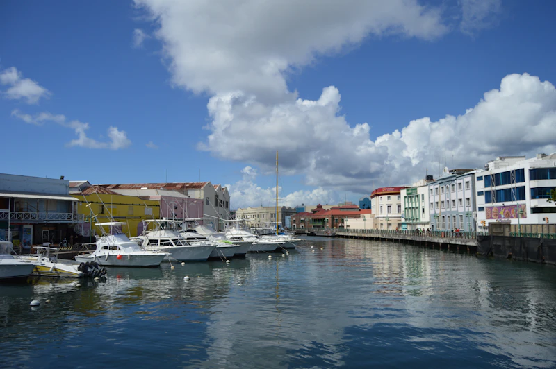 A boat docked on the Independence River in Bridgetown, Barbados, launch site of the Future Caribbean agentic AI buildathon