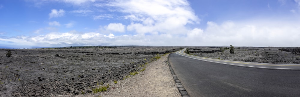 a road with gravel and grass on the side