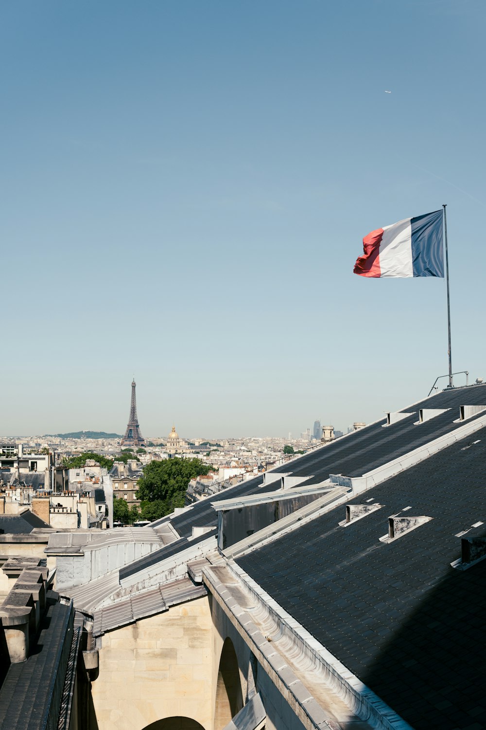 a flag flying on a roof