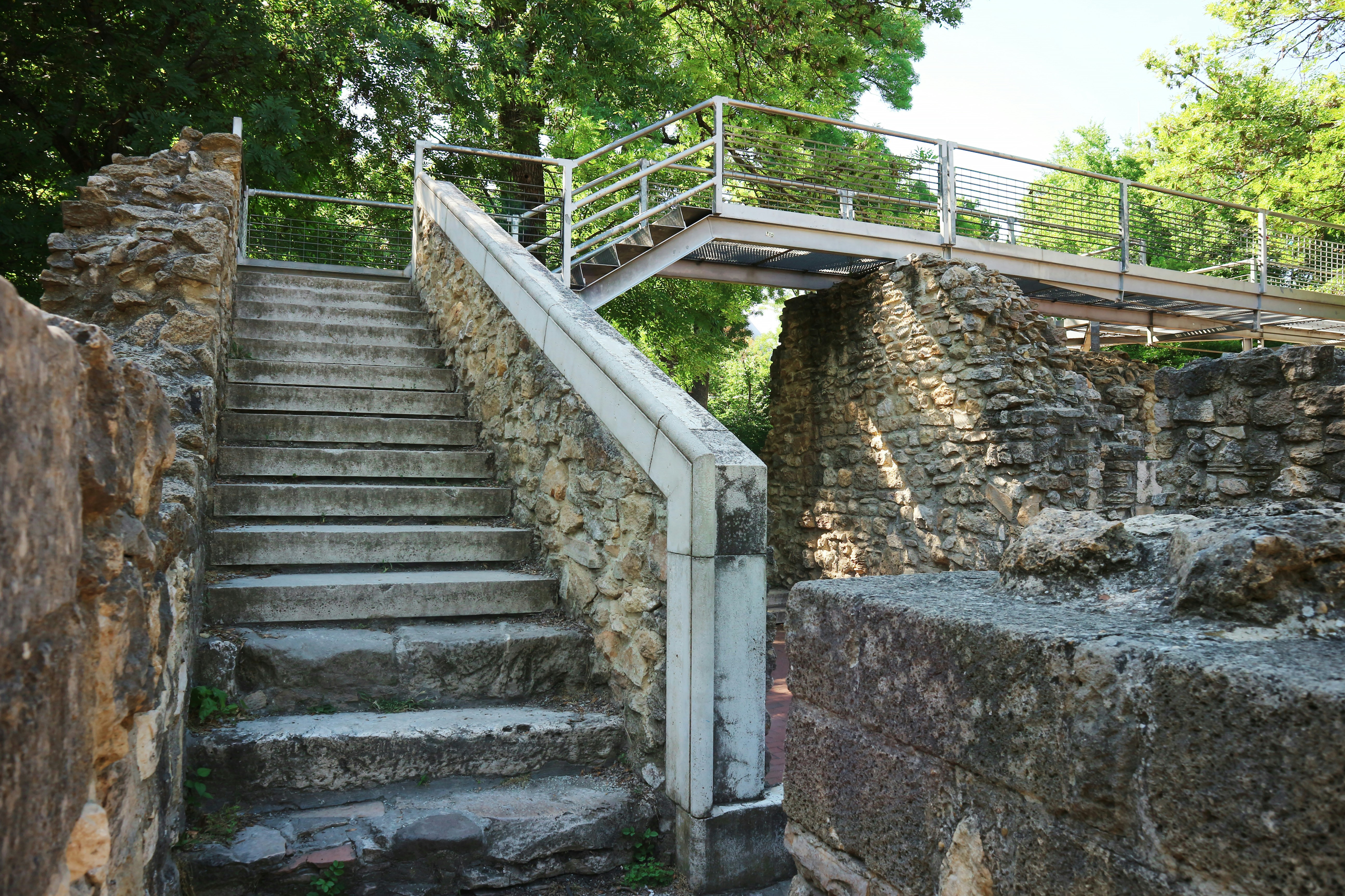 a stone staircase with a railing