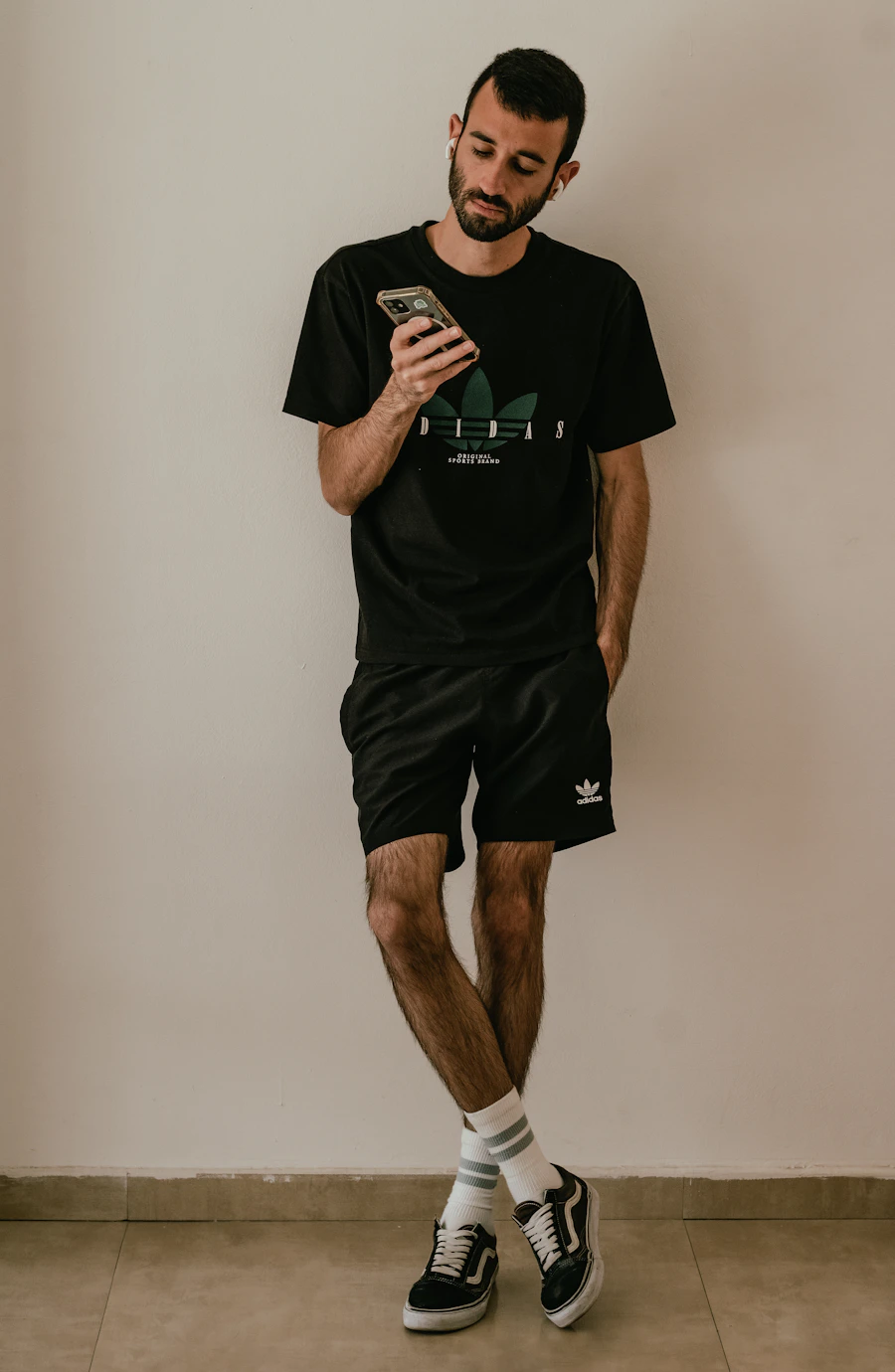 Man in a black casual menswear outfit