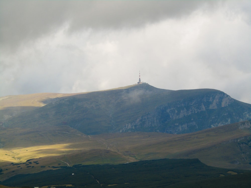 a mountain with a tower on top