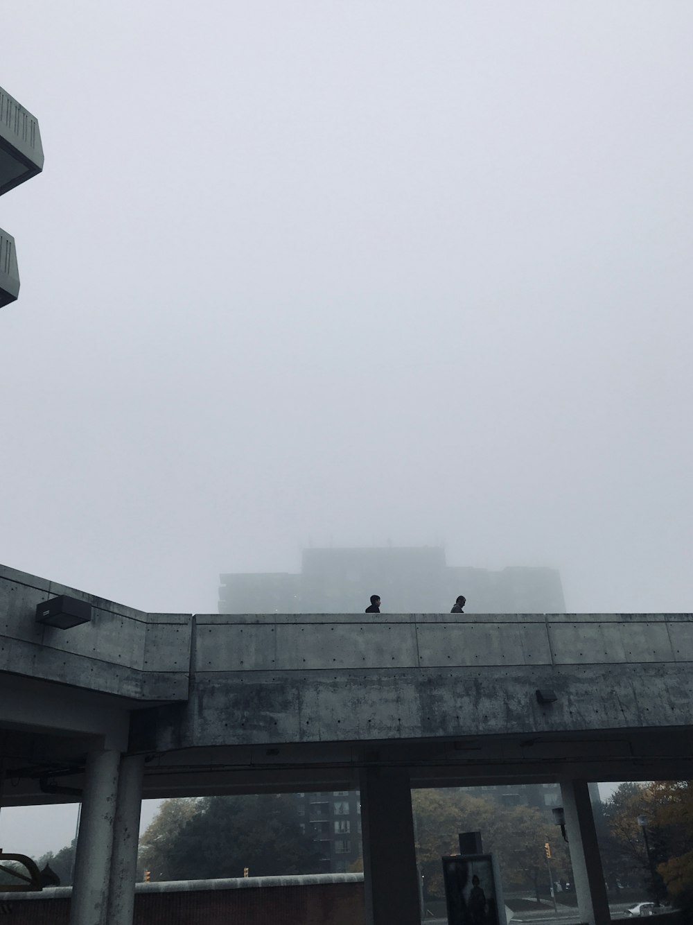 a bridge with a building in the background