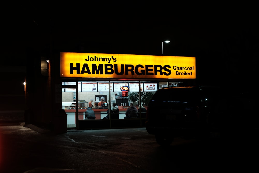 a restaurant with a yellow sign