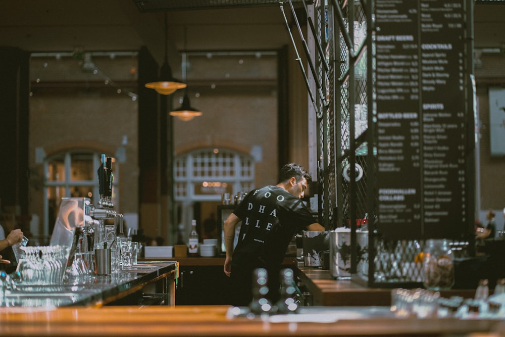 a man standing in a bar