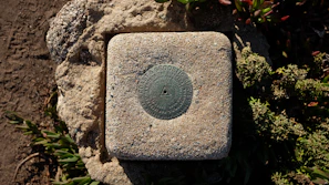 Outdoor site with markers indicating geomantic survey points.
