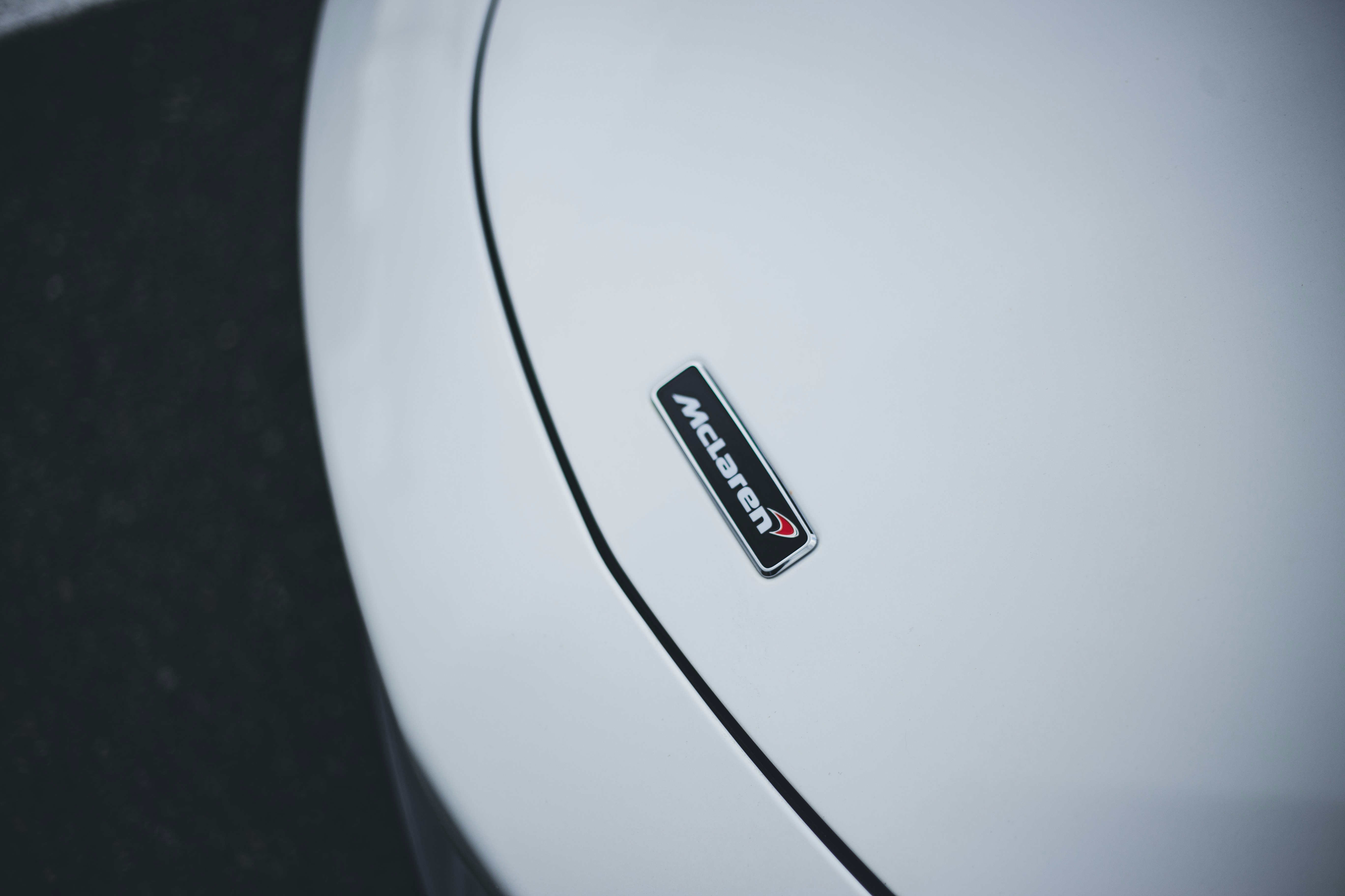 a black and white logo on a white surface