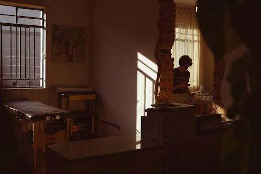 A serene scene of a therapist giving a Swedish massage in a cozy home setting with soft lighting.