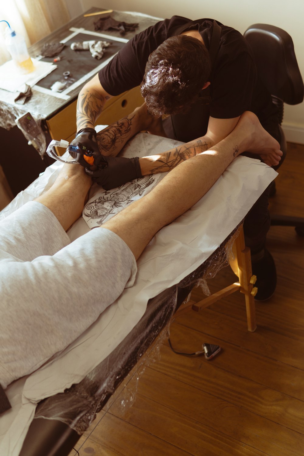 a person getting a tattoo