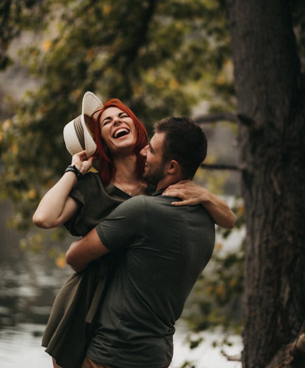 Happy couple smiling together representing restored vitality and connection