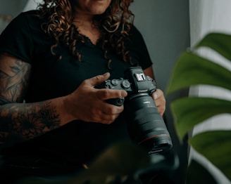 a person holding a camera