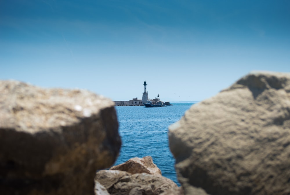 a lighthouse on a rocky island