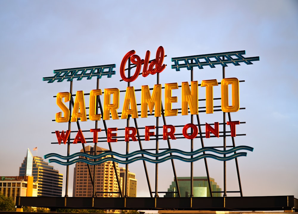 a sign with a building in the background