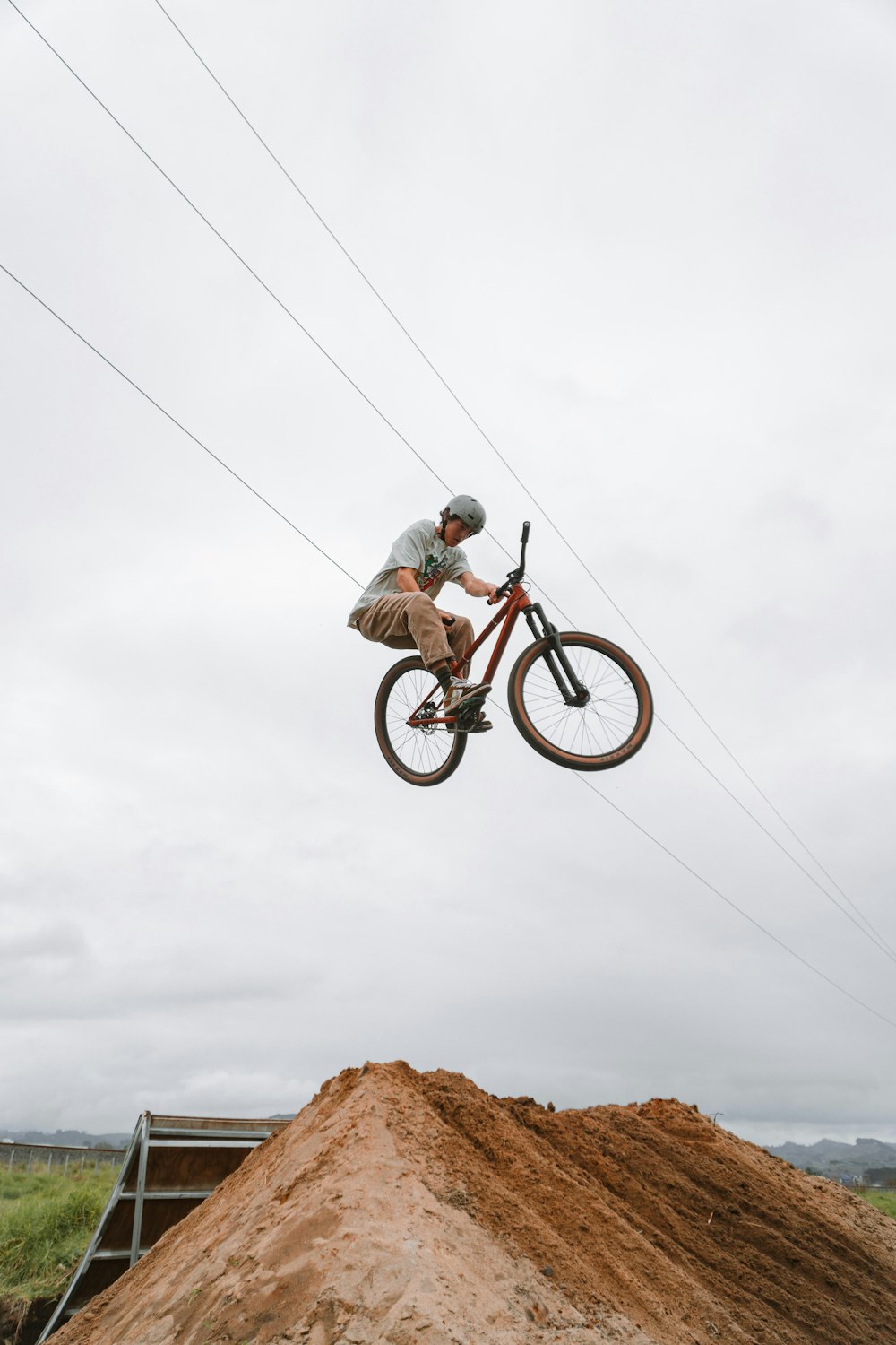 a man riding a bike on a dirt hill