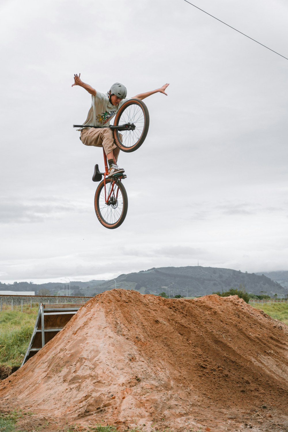 a man riding a bike on a dirt hill