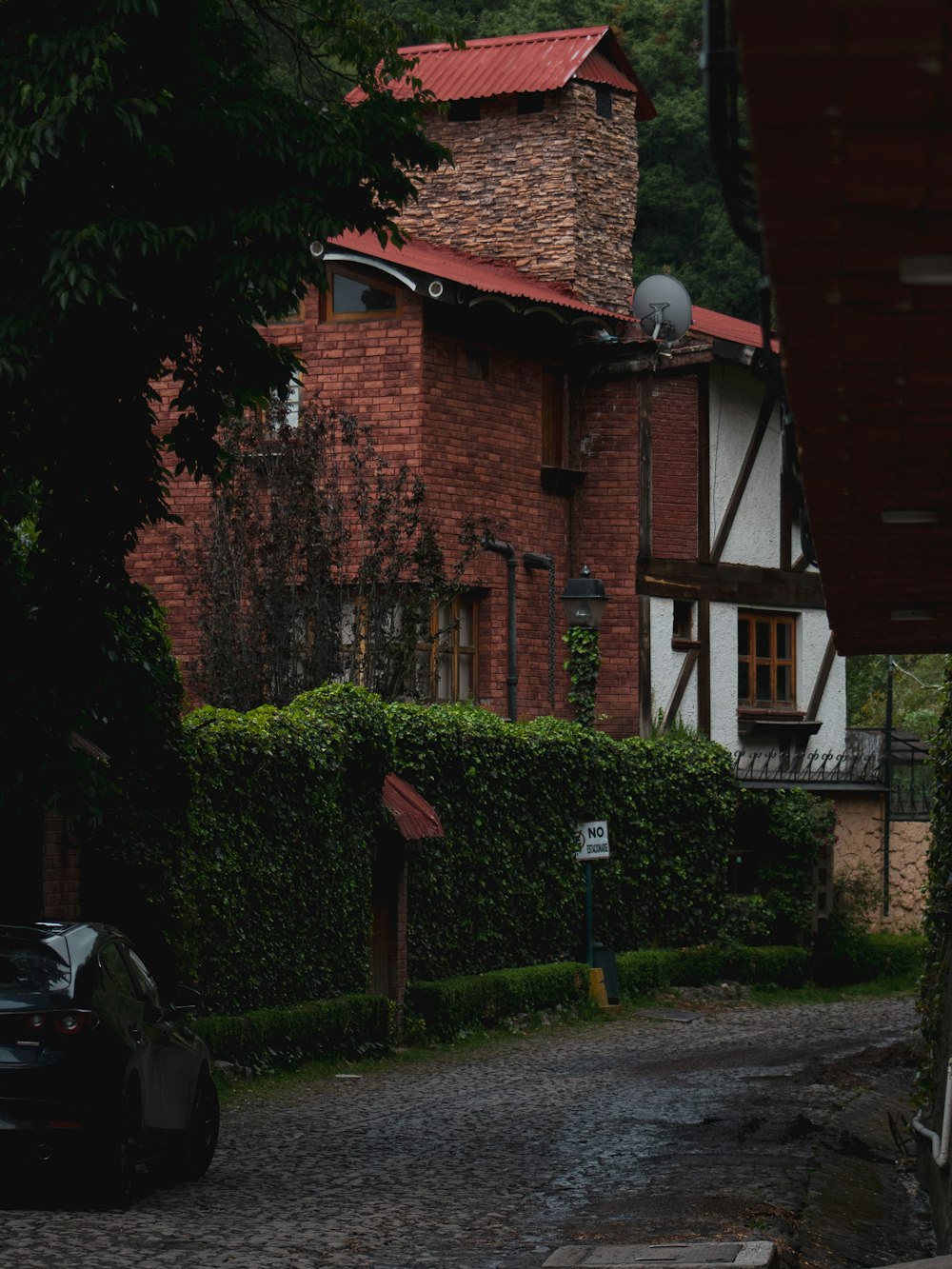 a brick building with a red roof