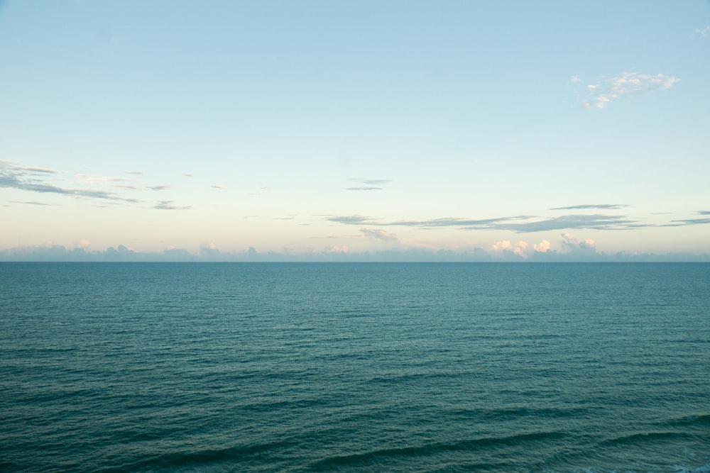 a body of water with a city in the distance