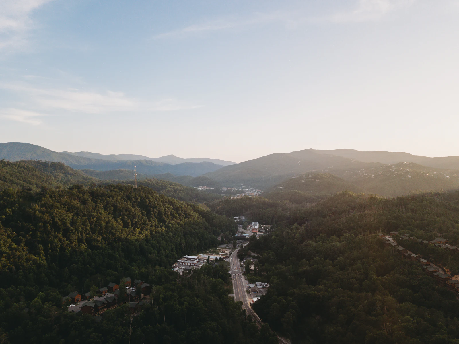 A mountain valley with a town spread along it.