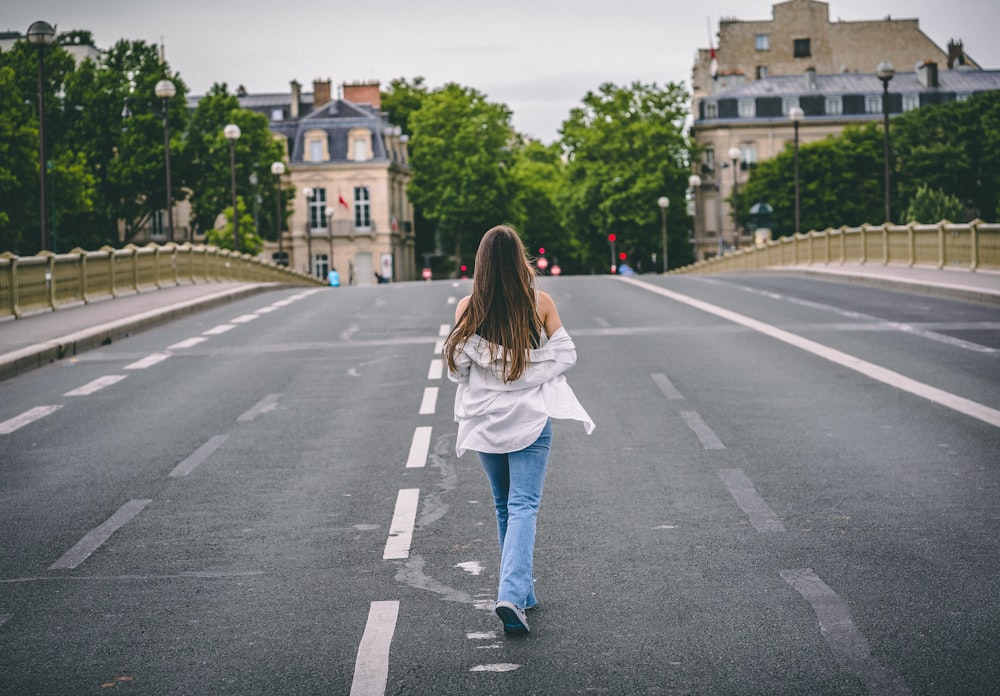 a person walking across a street