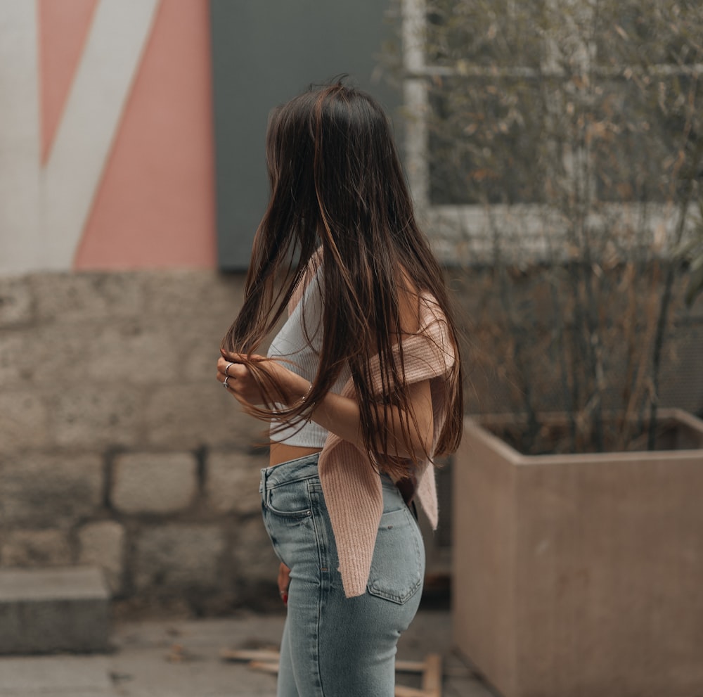 a woman with her hands in her pockets