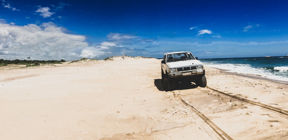 a car driving on a beach