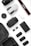 A collection of photography and drone equipment neatly arranged on a white surface. There is a camera lens, a drone, a camera strap with the Canon logo, several batteries, a battery charger, and memory cards. The black and white color scheme gives it a professional and sleek appearance.