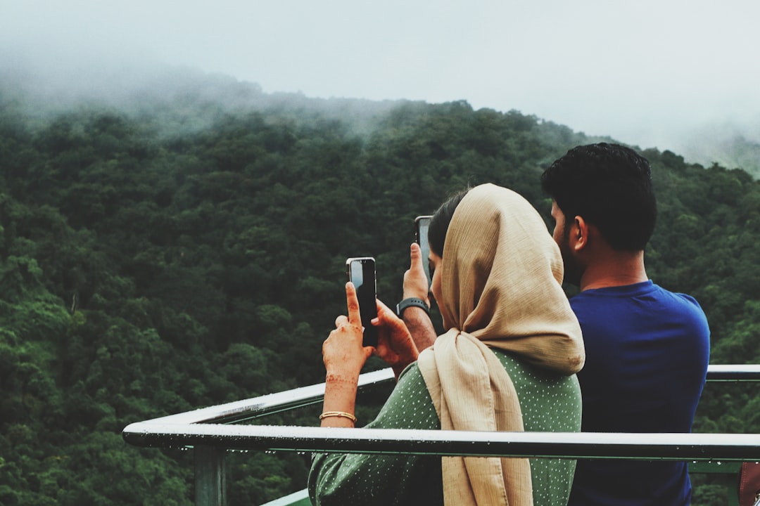 a man and woman taking pictures, 900 Kandi, Kerala